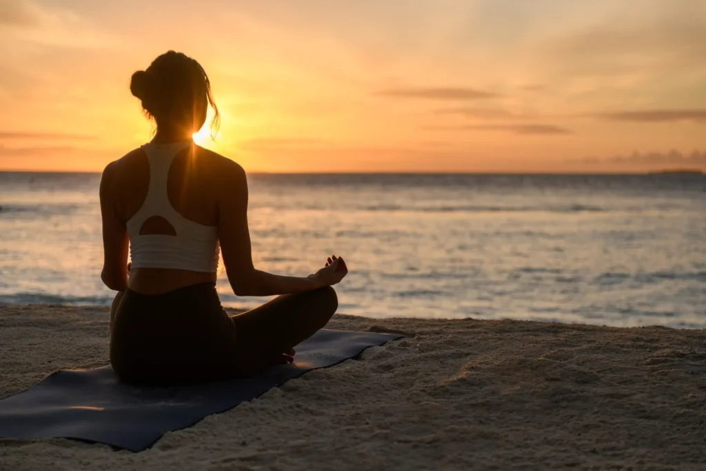 Sunrise yoga by the ocean