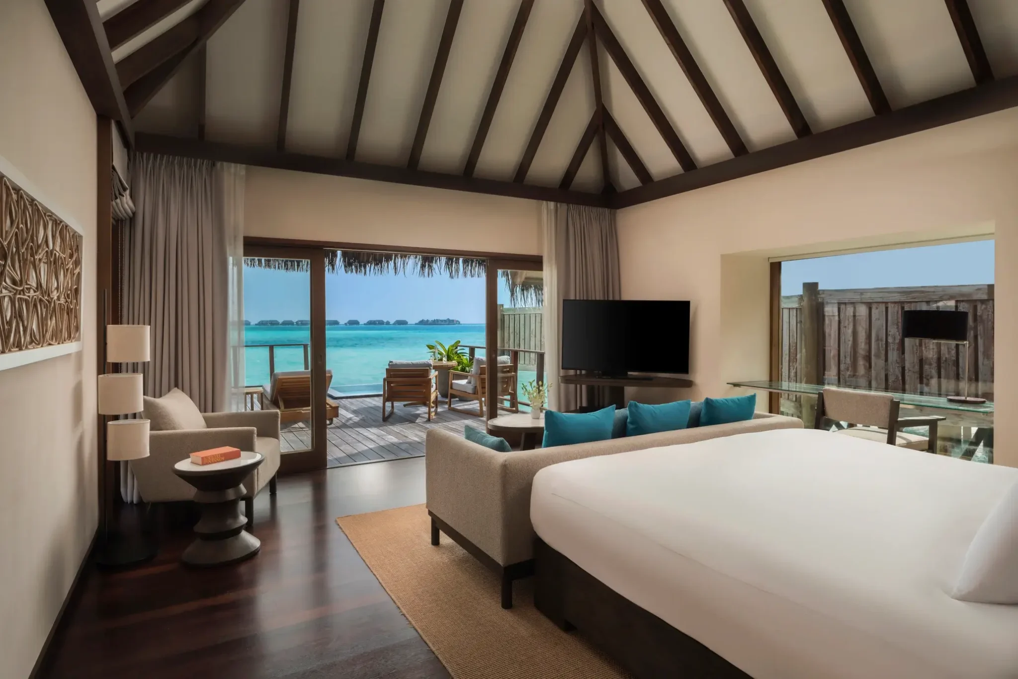 Sunrise Water Villa bedroom with lagoon view